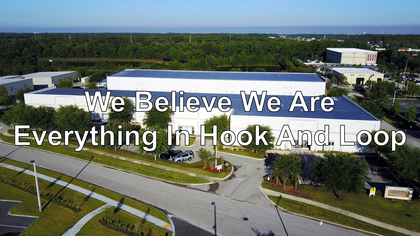 Company headquarters with company statement overlaid: We Believe We Are Everything In Hook And Loop
